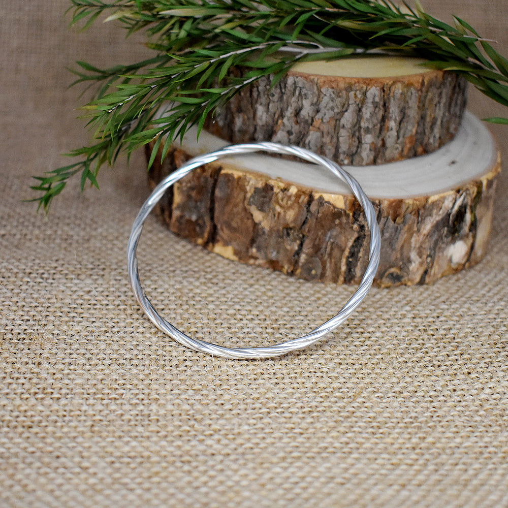 Phoebe twist silver bangle