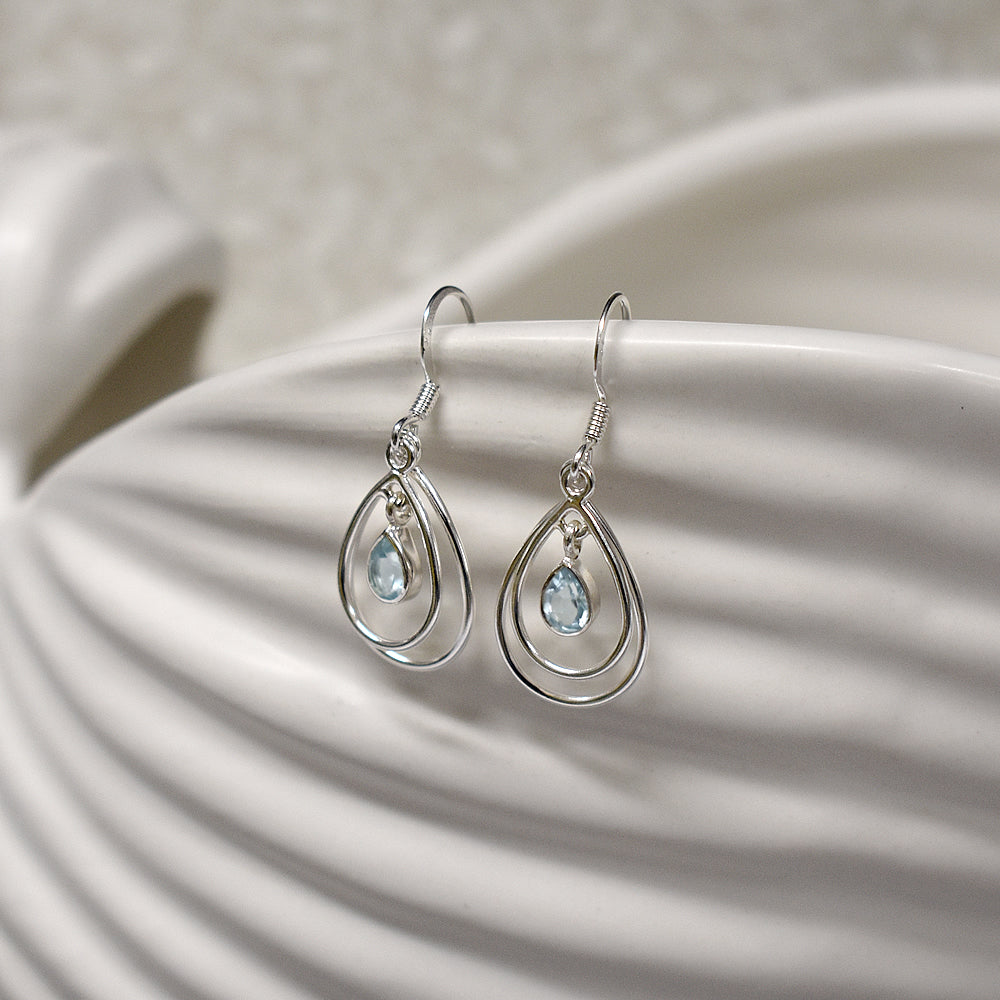 Ivy double teardrop faceted blue topaz earrings
