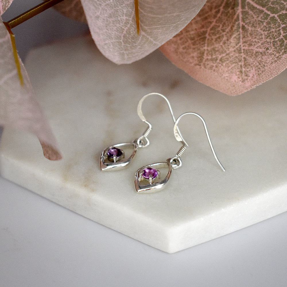 Kara faceted amethyst ellipse frame earrings