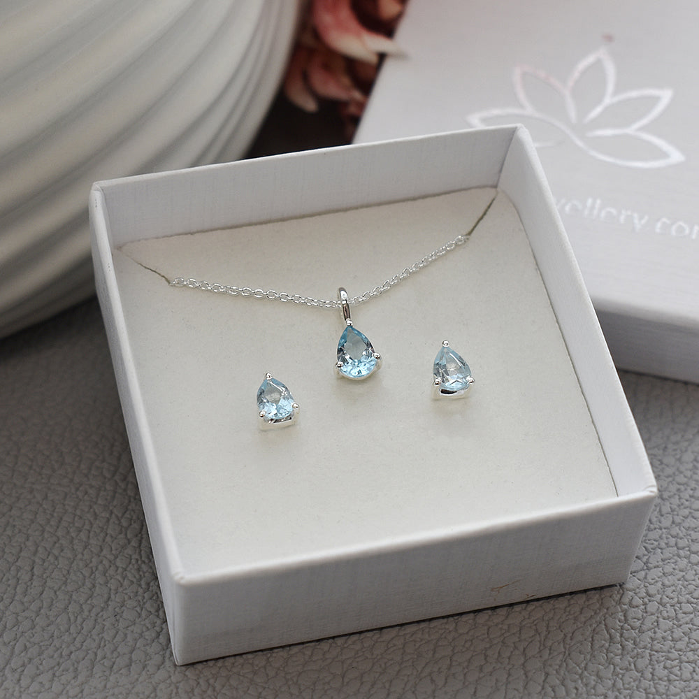 Kara teardrop blue topaz studs