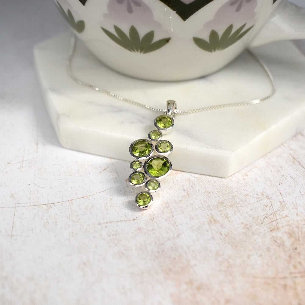 Lola long staggered peridot pendant