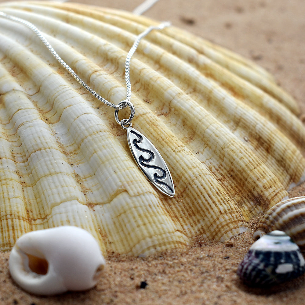 Mila surf board with wave pendant