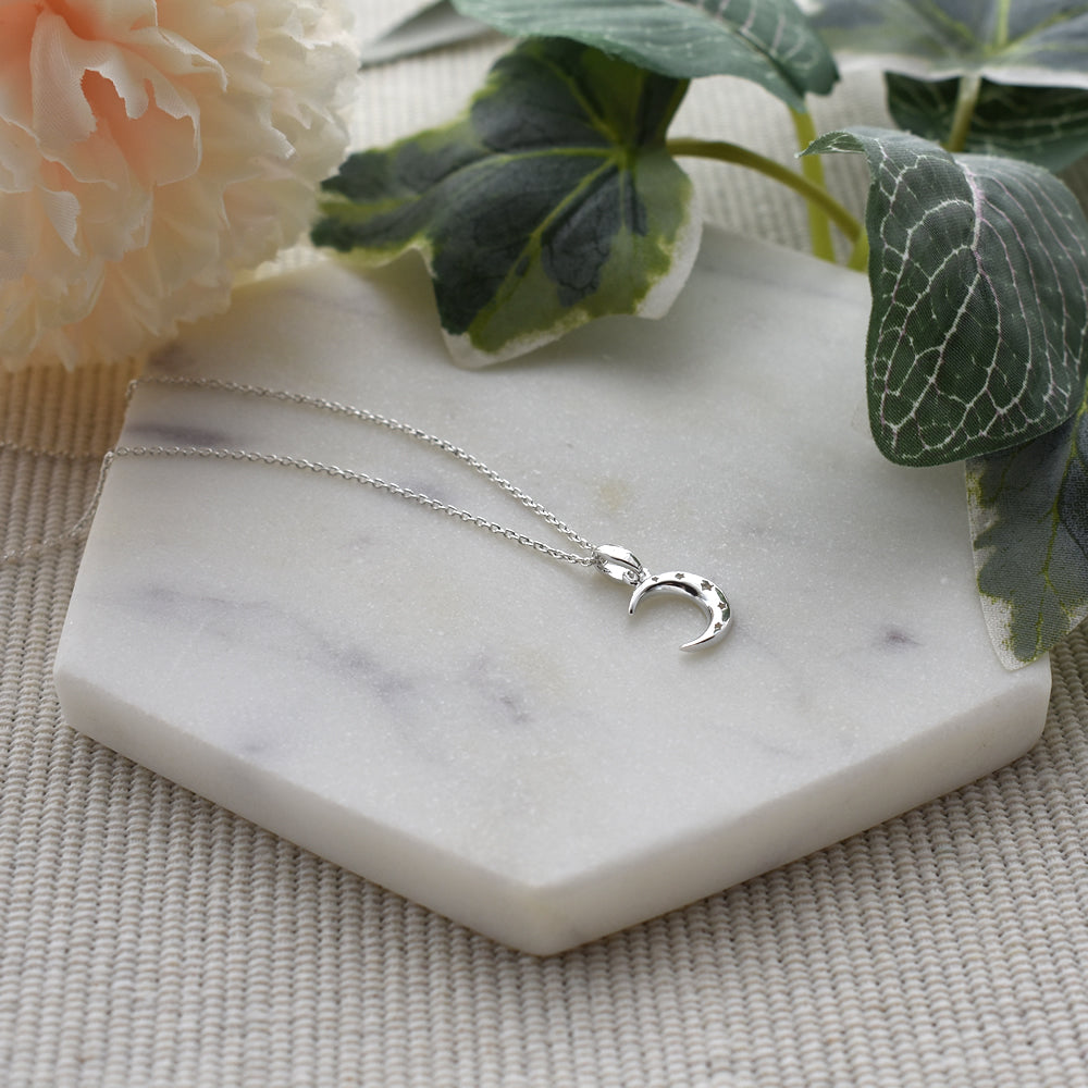 Dahna moon with cut out stars pendant