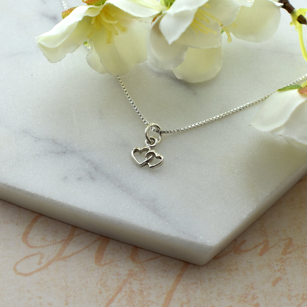 Smile linked lovers heart pendant
