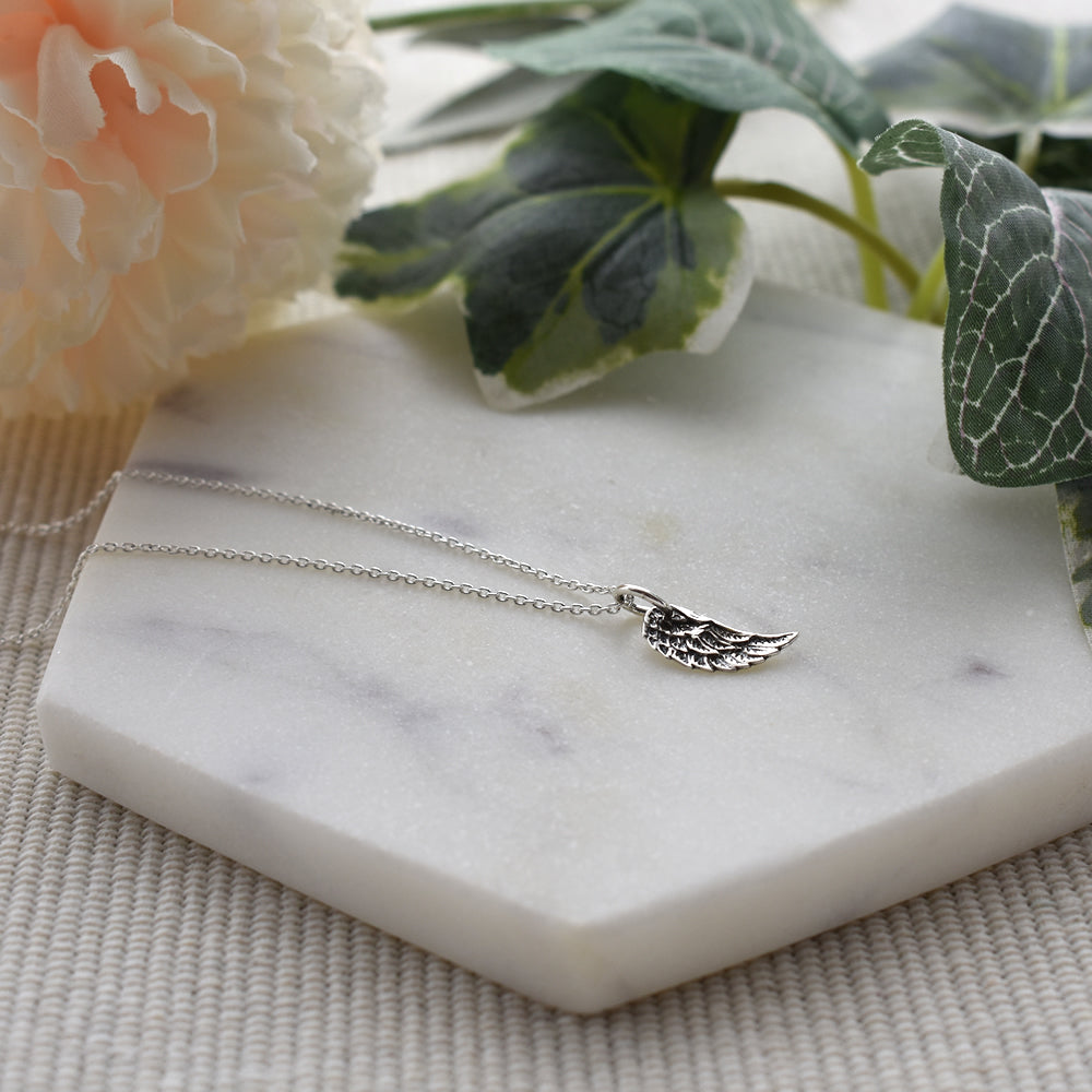 Smile oxidised angel wing pendant