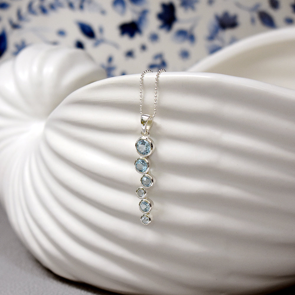 Lola staggered blue topaz pendant