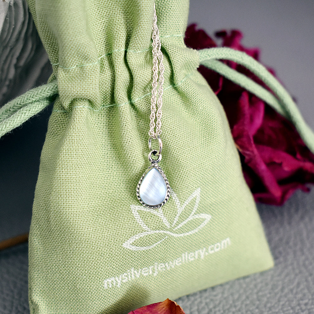 Smile oxidised teardrop pendant with blue mother of pearl