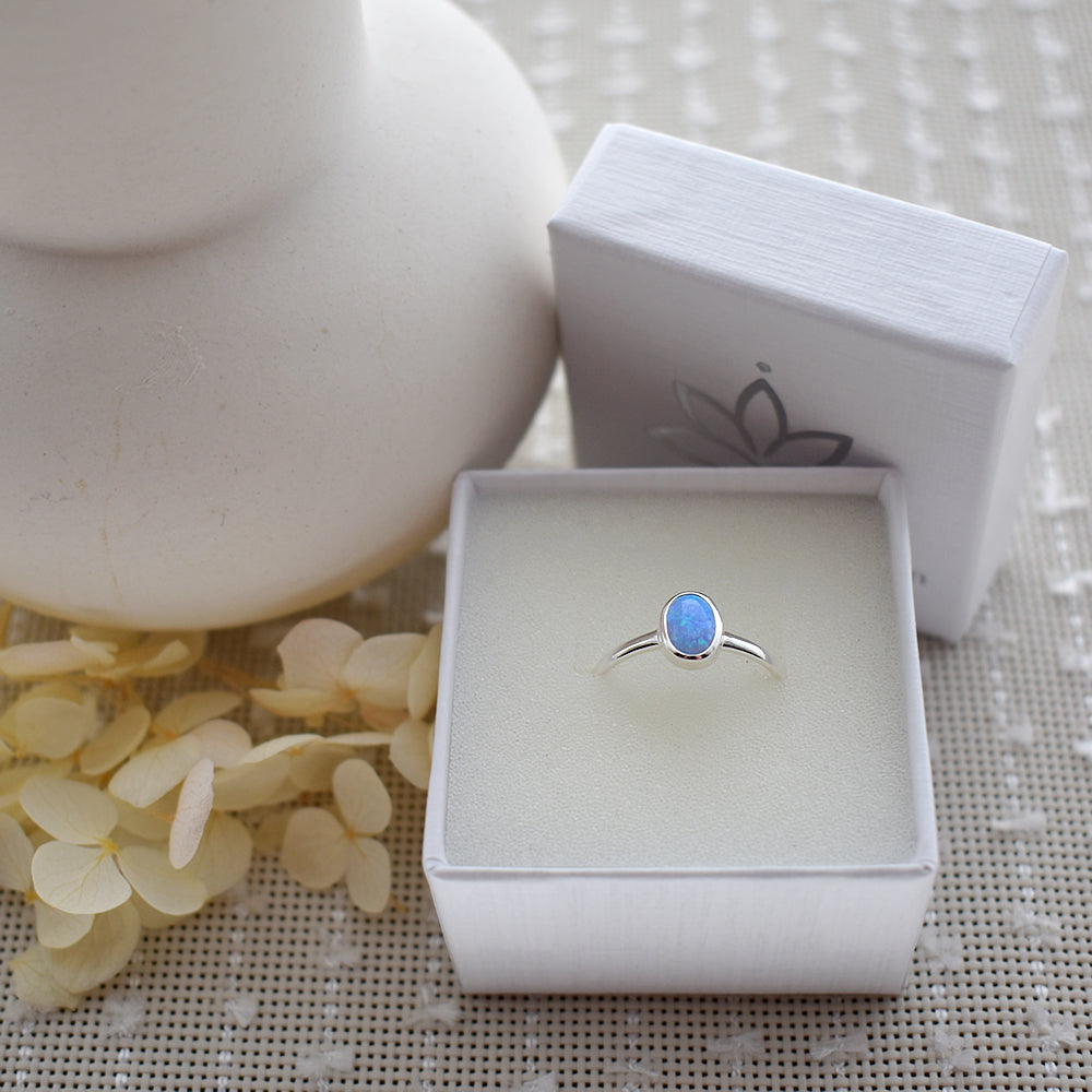 Angelica oval blue opalique plain shank ring