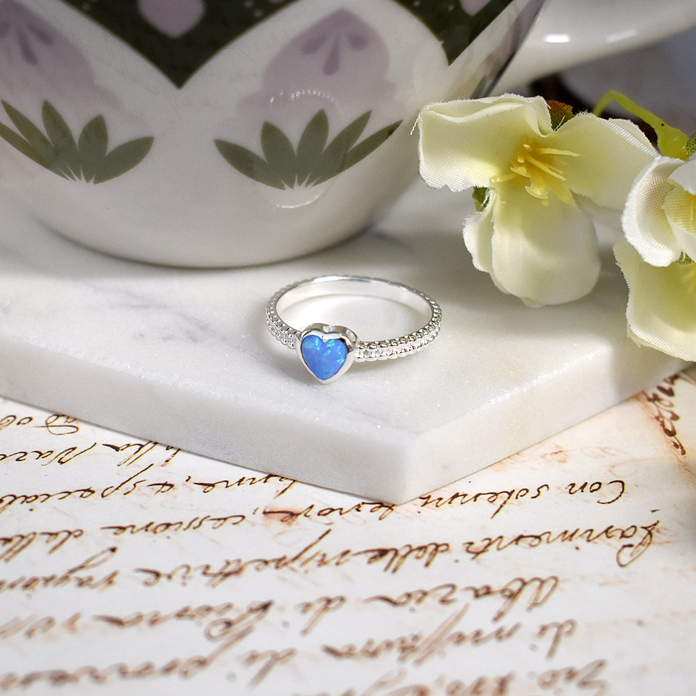 Angelica crimped band with blue opalique heart ring