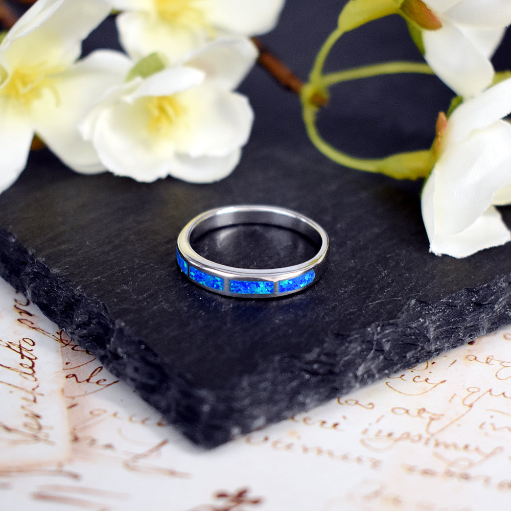 Diana framed inset blue opalique band ring