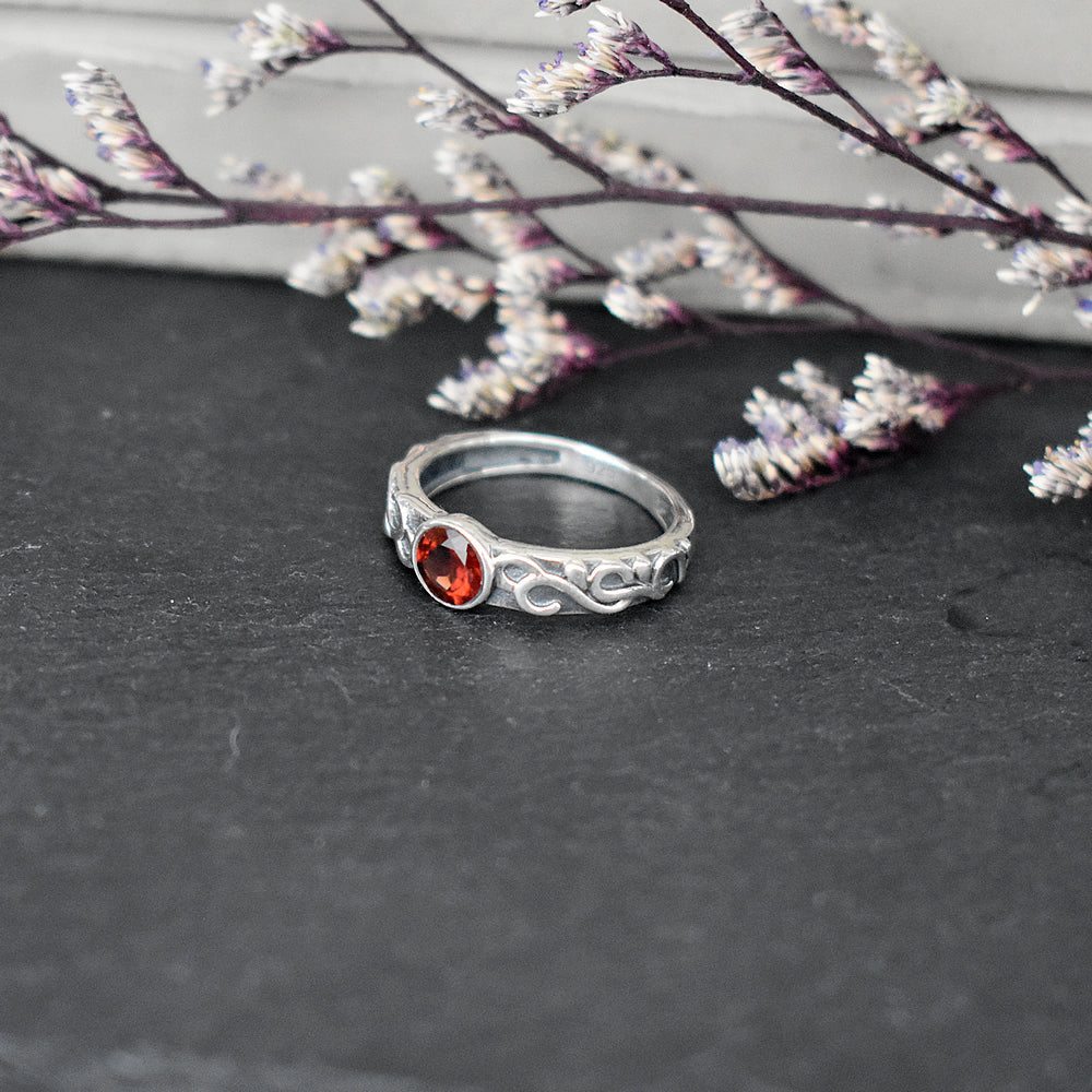 Betsy garnet facet Celtic style ring