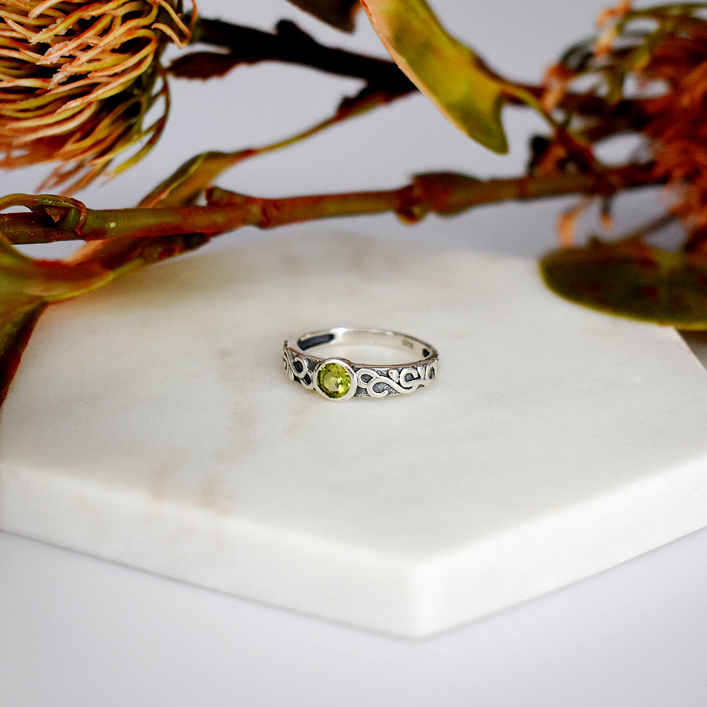Betsy peridot facet Celtic style ring