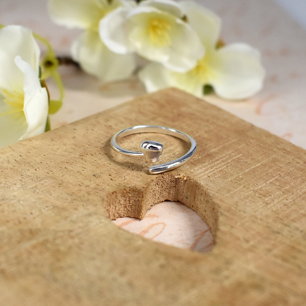 Wrap around heart motif ring