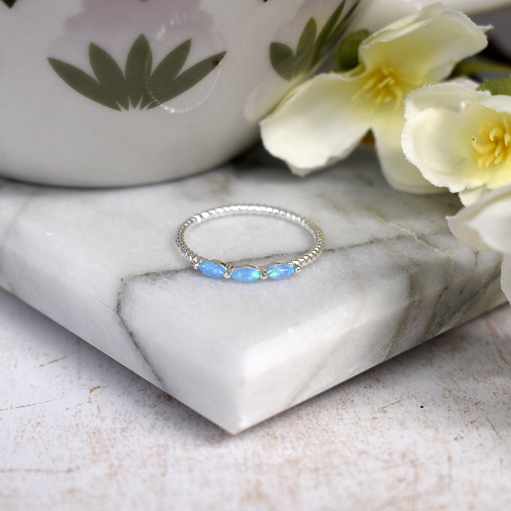 Bethan triple marquis blue opalique rope shank ring