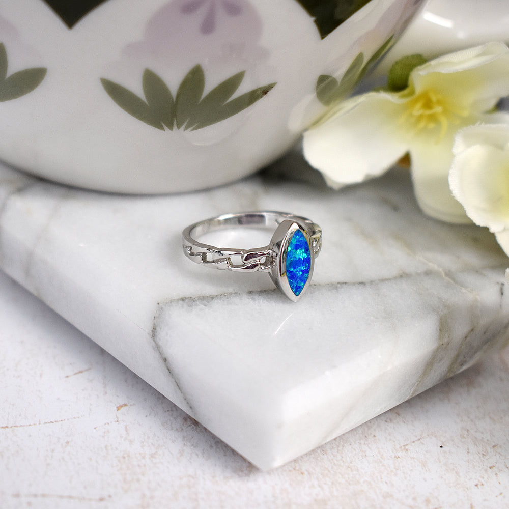 Antoinette marquis blue opalique curb shank ring