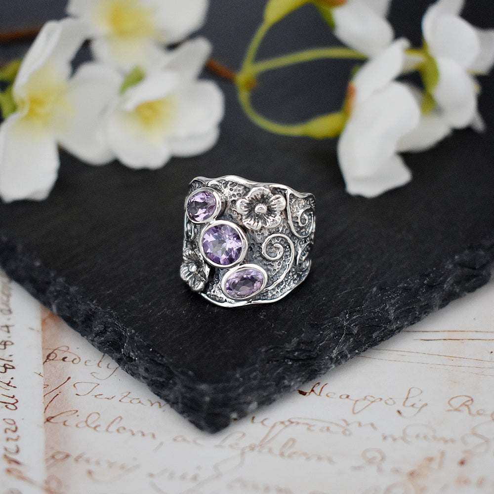 Oxidised wide flower band ring with 3 amethyst stones