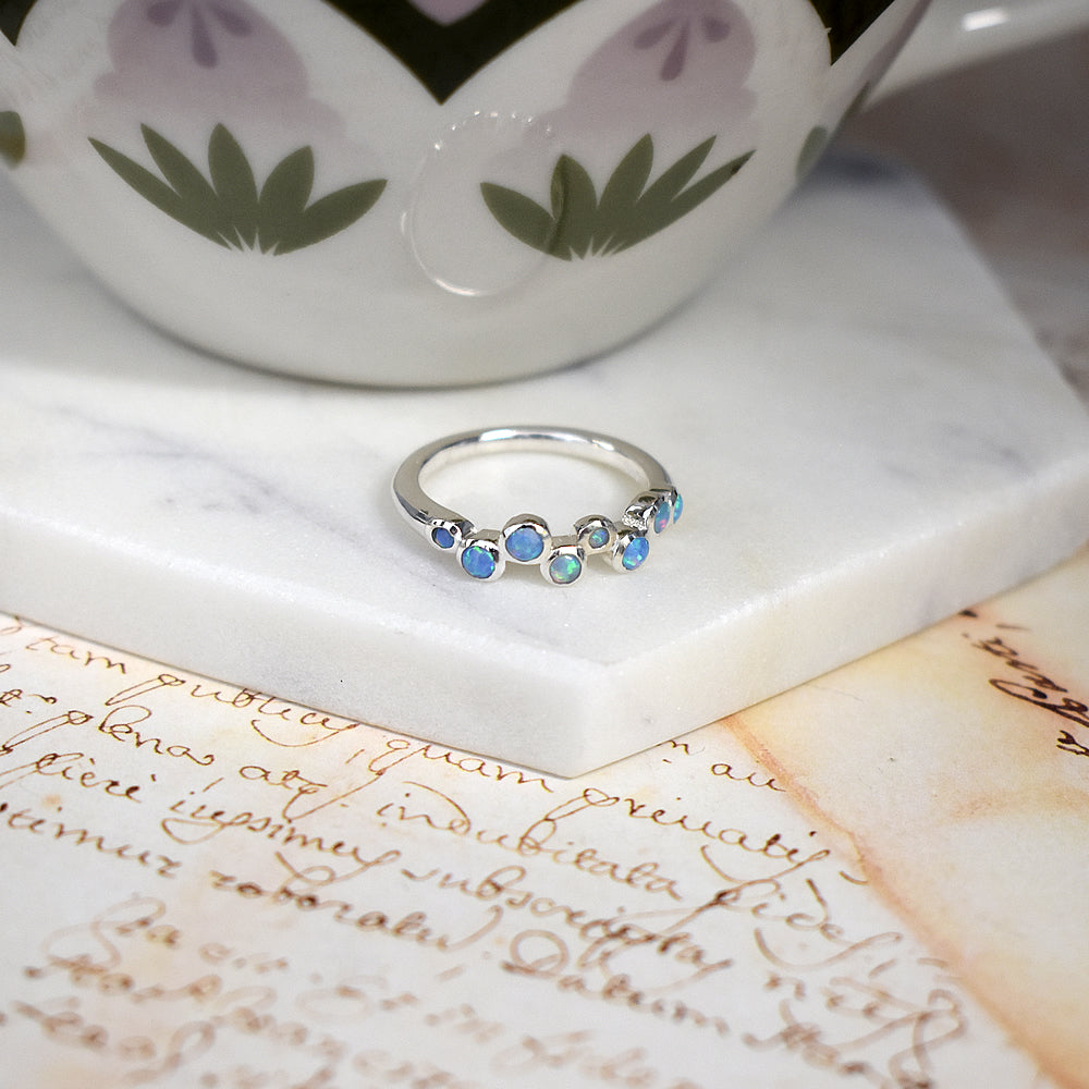 Angelica eight staggered blue opalique ring