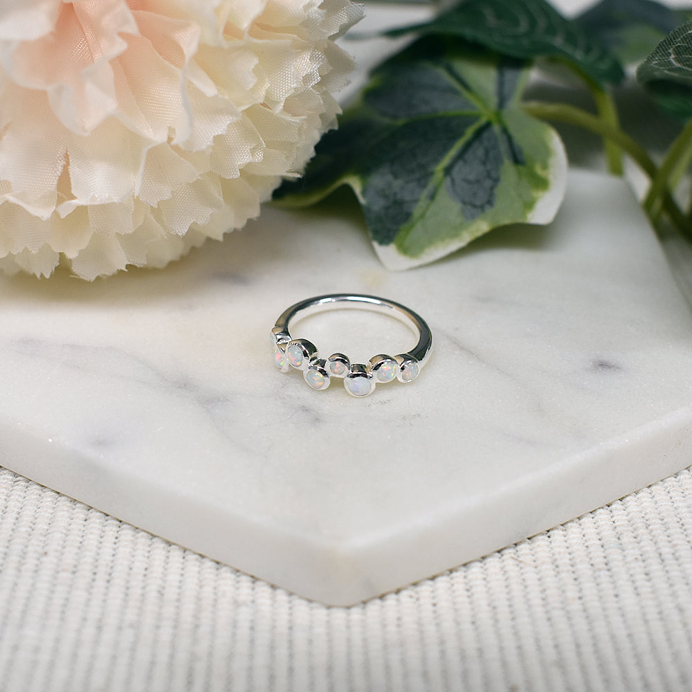 Angelica eight staggered white opalique ring