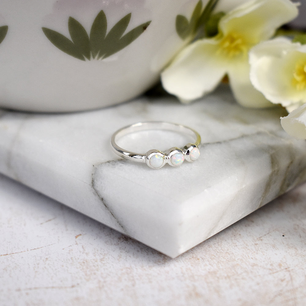 Angelica triple round white opalique ring