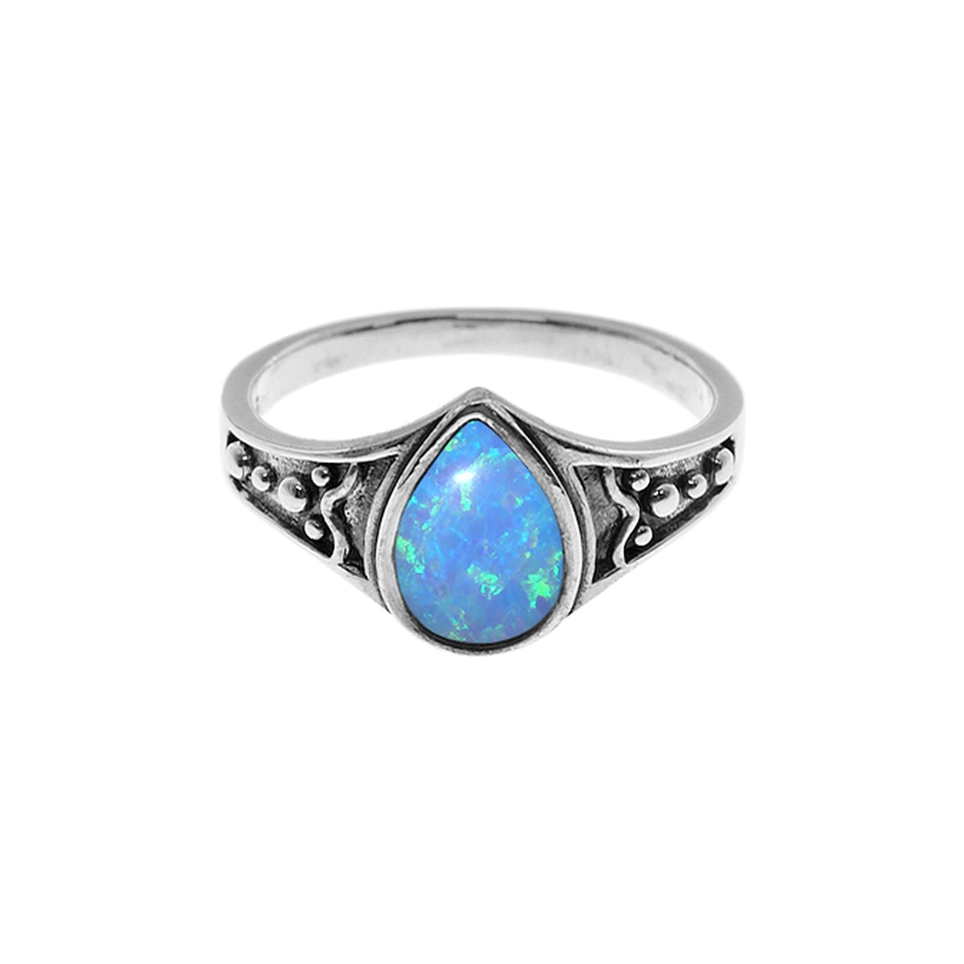 Sabrina teardrop blue opalique with shoulder detail ring