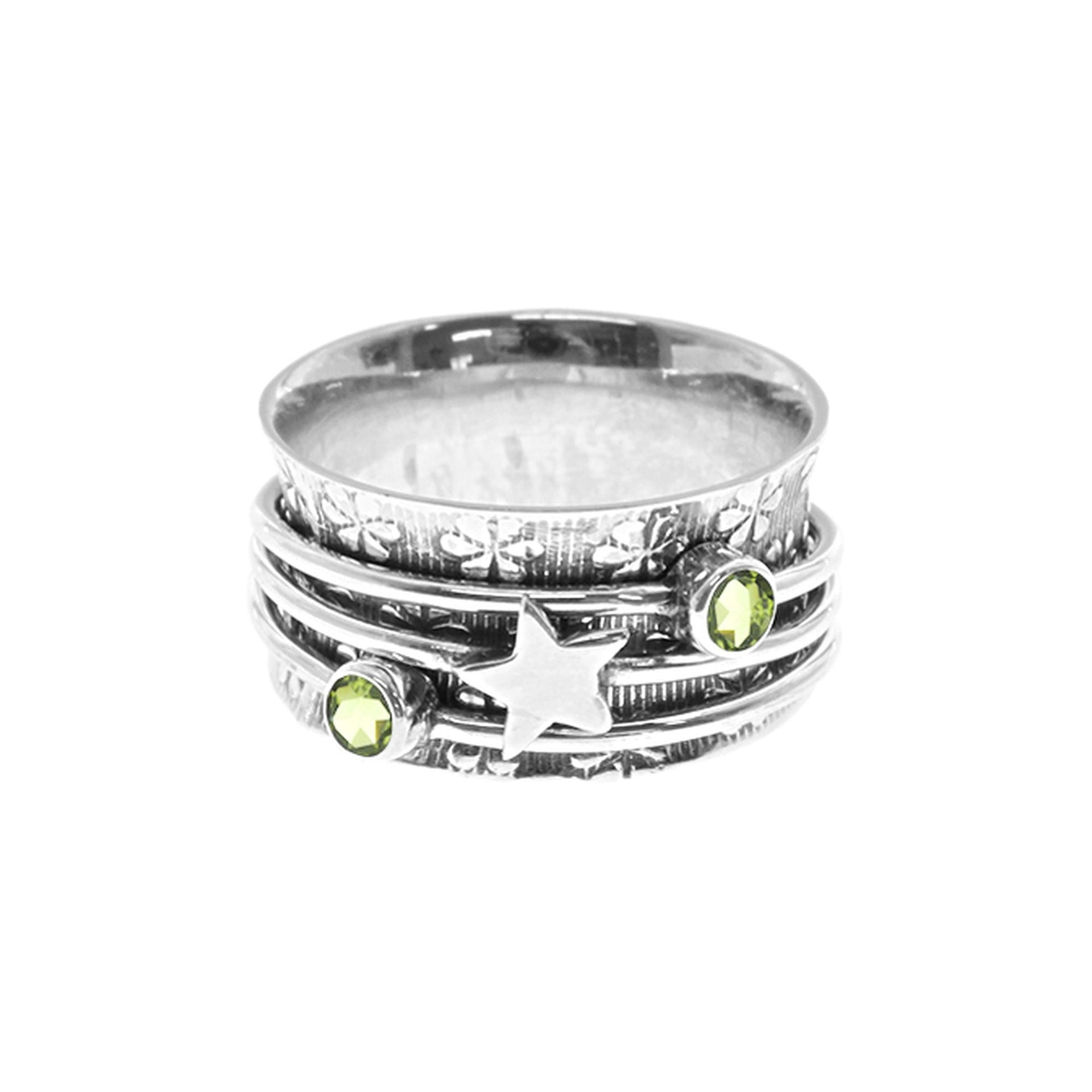 Catalina with triple spinner ring with star and peridot