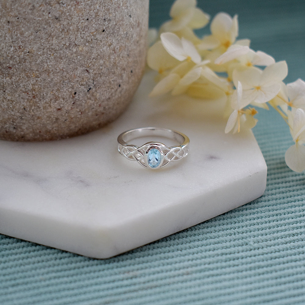 Betsy Celtic ring with oval blue topaz