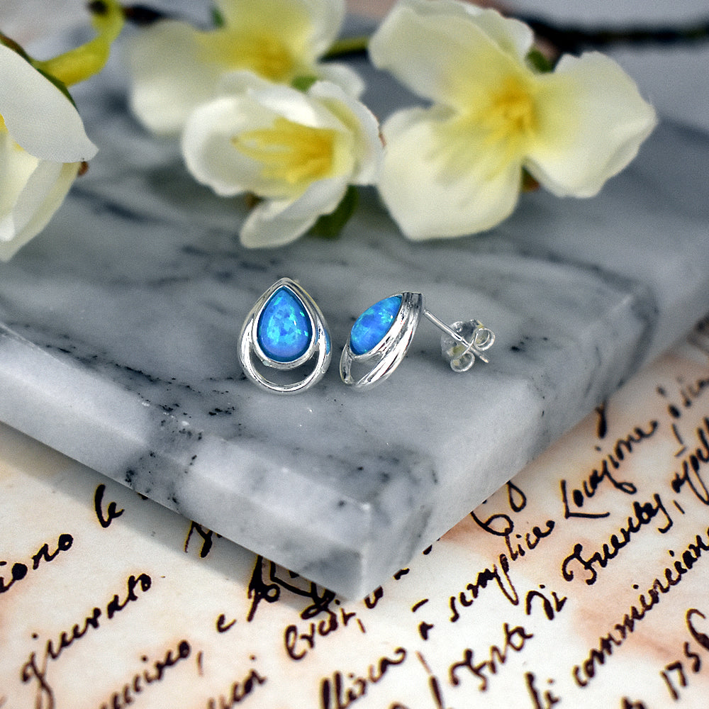 Angelica teardrop blue opalique wire surround studs